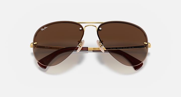 Ray-Ban RB3449 Arista Gold with Brown Gradient Gradient lenses - Closed Front
